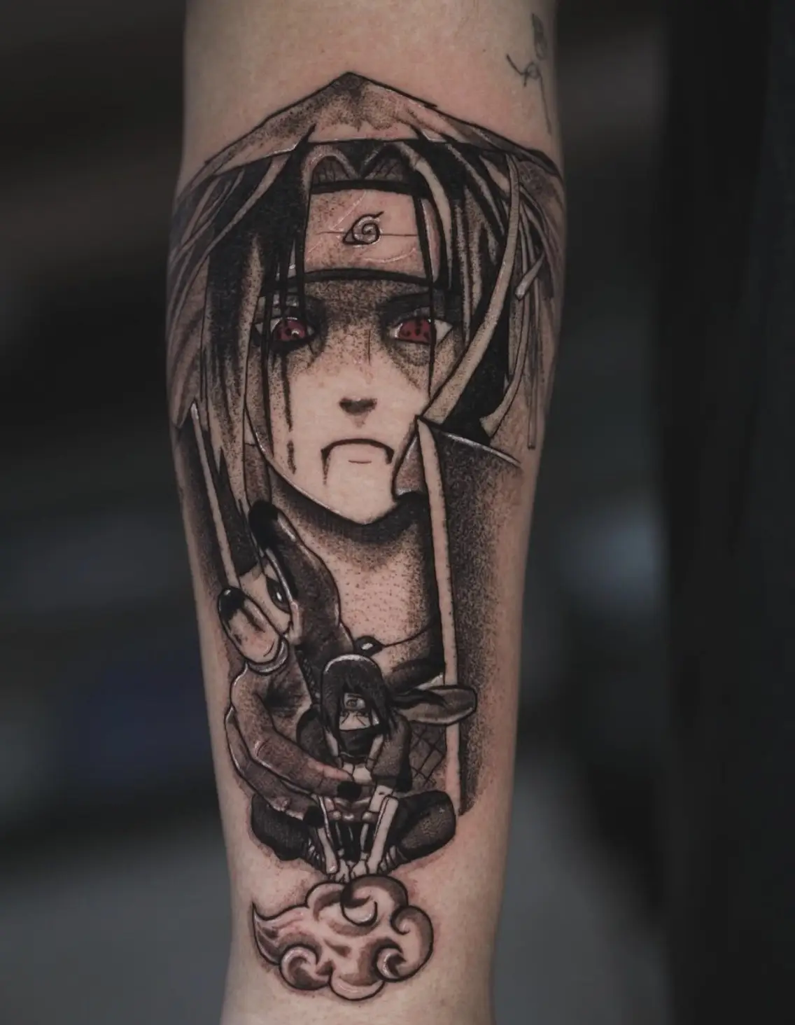 Itachi Uchiha portrait tattoo with sharingan eyes and emotional expression by Sara at Omnia Tattoo Melbourne